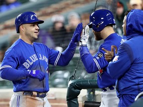 Steve Pearce (left) of the Toronto Blue Jays celebrates after hitting a home run against the Baltimore Orioles at Oriole Park at Camden Yards on April 9, 2018 in Baltimore. (Rob Carr/Getty Images)