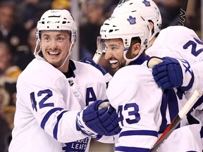 James van Riemsdyk of the Toronto Maple Leafs celebrates with Nazem Kadri and Tyler Bozak after scoring a goal against the Boston Bruins during Game 5 at TD Garden on April 21, 2018