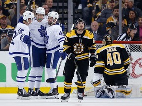 James van Riemsdyk (25) celebrates his goal with teammates Tyler Bozak (42) and Nazem Kadri (43) during the second period of Game 5 against the Bruins in Boston on Saturday night. (The Associated Press)