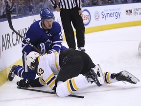 Kasperi Kapanen battles Charlie McAvoy during Game 6 (JACK BOLAND/TORONTO SUN)