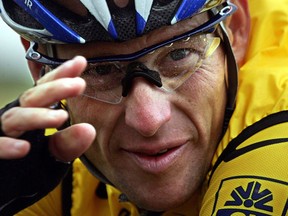 This July 8, 2004 file photo shows Lance Armstrong during the fifth stage of the 91st Tour de France cycling race between Amiens and Chartres