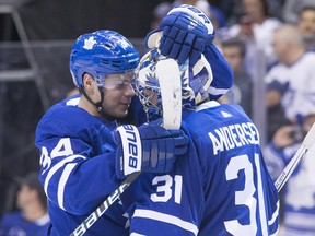Auston Matthews (left) celebrates with goaltender Frederik Andersen after the Maple Leafs defeated the Montreal Canadiens in the season finale on Saturday. (The Canadian Press)