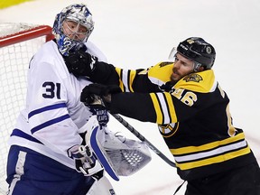 Boston Bruins centre David Krejci (46) checks Toronto Maple Leafs goaltender Frederik Andersen (31) during Game 7 in Boston, Wednesday, April 25, 2018. (AP Photo/Charles Krupa)