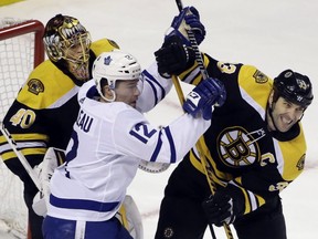 Toronto Maple Leafs center Patrick Marleau (12) struggles for position against Boston Bruins defenseman Zdeno Chara (33) in front of Bruins goaltender Tuukka Rask (40) during the first period of Game 1 of an NHL hockey first-round playoff series Thursday, April 12, 2018, in Boston.