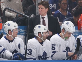 Head coach Mike Babcock of the Toronto Maple Leafs looks on during first period action against the Florida Panthers at the BB&T Center on Feb. 27, 2018