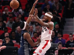 Toronto Raptors guard Lorenzo Brown passes as Detroit Pistons guard Langston Galloway defends during NBA action on April 9, 2018