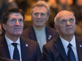 Leaf coach, Mike Babcock, left, and Lou Lamoriello, right, attend the Johnny Bower celebration of Life service at the ACC in Toronto on January 3, 2018. (Craig Robertson/Toronto Sun/Postmedia Network)