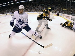 Toronto Maple Leafs' Auston Matthews (34) keeps the puck from Boston Bruins' Rick Nash during the first period of Game 2 in Boston lasta night. (AP Photo/Winslow Townson)