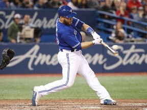 Russell Martin of the Toronto Blue Jays hits a two-run home run in the seventh inning against the Chicago White Sox at Rogers Centre on April 2, 2018