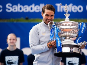 Rafael Nadal of Spain poses with the trophy after his victory against Stefanos Tsitsipas of Greece in their final match during day seven of the Barcelona Open Banc Sabadell on April 29, 2018 in Barcelona, Spain. (Alex Caparros/Getty Images)