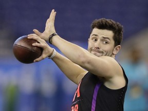 Oklahoma quarterback Baker Mayfield runs a drill during the NFL football scouting combine, Saturday, March 3, 2018, in Indianapolis.