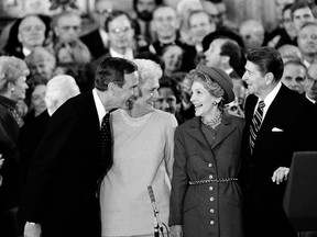 FILE – In this Jan. 21, 1985, file photo, U.S. President Ronald Reagan and his wife, Nancy, right, stand with Vice President George Bush and Barbara Bush following the oaths in the Capitol Building in Washington. A family spokesman said Tuesday, April 17, 2018, that former first lady Barbara Bush has died at the age of 92.