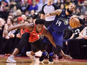 Toronto Raptors forward OG Anunoby fouls Orlando Magic guard D.J. Augustin during NBA action on April 8, 2018