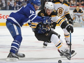 David Pastrnak of the Boston Bruins skates against Patrick Marleau of the Toronto Maple Leafs during Game 6 at the Air Canada Centre on April 23, 2018