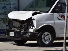 A van with a damaged front-end is shown on a sidewalk after a van mounted a sidewalk crashing into a number of pedestrians in Toronto on Monday, April 23, 2018. THE CANADIAN PRESS/Frank Gunn