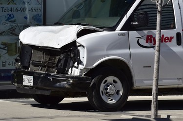 A van with a damaged front-end is shown on a sidewalk after a van mounted a sidewalk crashing into a number of pedestrians in Toronto on Monday, April 23, 2018. THE CANADIAN PRESS/Frank Gunn
