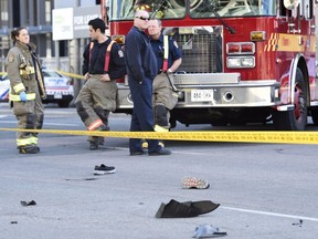 Shoes lay in the street as first responders secure the area in Toronto after a van mounted a sidewalk crashing into a number of pedestrians on Monday, April 23, 2018. THE CANADIAN PRESS/Nathan Denette