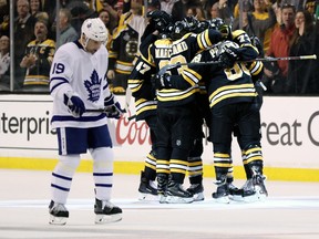 Tomas Plekanec of the Toronto Maple Leafs reacts as members of the Boston Bruins celebrate a goal at TD Garden on April 12, 2018
