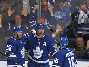 Patrick Marleau (centre) of the Toronto Maple Leafs celebrates his second goal of the game with Tomas Plekanec (let) and Mitchell Marner on Monday night against the Boston Bruins. The Maple Leafs defeated the Bruins 4-2. (Claus Andersen/Getty Images)