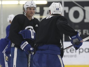 Toronto Maple Leafs Morgan Rielly D (44) spars with teammate Ron Hainsey D (2) during practice time in preparation for their game in New Jersey on Thursday. Jack Boland/Toronto Sun