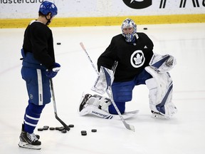 Toronto Maple Leafs forward Matt Martin talks with goalie Frederik Andersen during practice at the MasterCard Centre on April 18, 2018