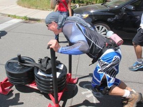 Toronto Police Supt. Heinz Kuck will take on his latest challenge, Push for Literacy, on June 16. The 11 Division Commander is seen here pushing a weighted sled through the city during a similar challenge in 2016, Push for Hope.