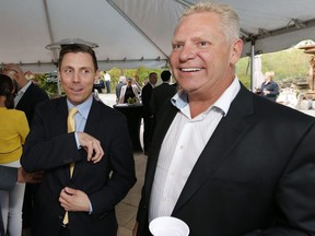 Then Ontario PC leader Patrick Brown (left) is welcomed at a reception by Doug Ford at the Ford family house  in Toronto on May 14, 2015. (Michael Peake/Toronto Sun)