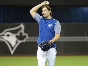 Randal Grichuk of the Toronto Blue Jays warms up before the start of Opening Day against the New York Yankees on March 29, 2018