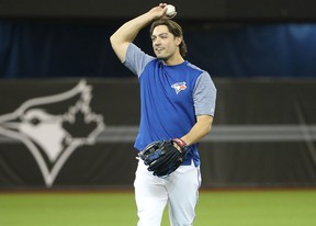 Randal Grichuk of the Toronto Blue Jays warms up before the start of Opening Day against the New York Yankees on March 29, 2018