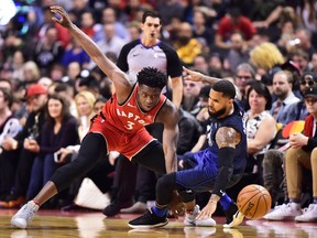 Toronto Raptors forward OG Anunoby fouls Orlando Magic guard D.J. Augustin during first half NBA basketball action in Toronto on, April 8, 2018
