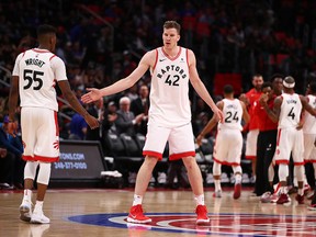Jakob Poeltl of the Toronto Raptors celebrates with Delon Wright at Little Caesars Arena on April 9, 2018 in Detroit. (Gregory Shamus/Getty Images)