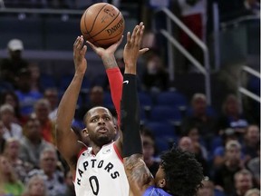 Toronto Raptors' CJ Miles (0) takes a shot over Orlando Magic's Wesley Iwundu (25) during the first half of an NBA basketball game, Tuesday, March 20, 2018, in Orlando, Fla.