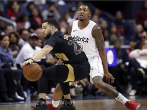 Toronto Raptors guard Fred VanVleet (23) works to get past Washington Wizards guard Bradley Beal (3) during the second half of Game 6 of an NBA basketball first-round playoff series Friday, April 27, 2018.