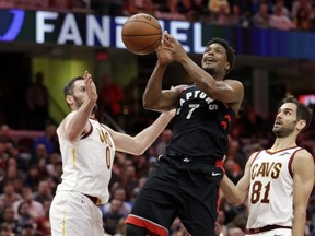 Toronto Raptors' Kyle Lowry (7) loses control of the ball between Cleveland Cavaliers' Kevin Love (0) and Jose Calderon (81) during the second half of an NBA basketball game Tuesday, April 3, 2018, in Cleveland. The Cavaliers won 112-106. (AP Photo/Tony Dejak)