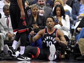 Toronto Raptors guard DeMar DeRozan (10) looks on from the floor during the second half of Game 3 of an NBA basketball first-round playoff series against the Washington Wizards, Friday, April 20, 2018, in Washington. (AP Photo/Nick Wass) ORG XMIT: VZN120
