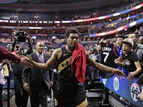 Toronto Raptors guard Kyle Lowry celebrates with fans as he leaves the court after Game 6 of the team's NBA basketball first-round playoff series Washington Wizards, Friday, April 27, 2018, in Washington. The Raptors won 102-92 and took the series. (AP Photo/Alex Brandon) ORG XMIT: VZN121