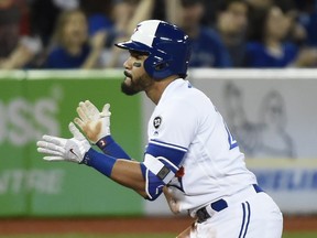 Toronto Blue Jays' Devon Travis reacts after hitting a triple during the seventh inning of his team's game against the Boston Red Sox on April 26, 2018.
(NATHAN DENETTE/The Canadian Press)