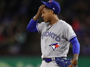 Marcus Stroman of the Toronto Blue Jays reacts after giving up a two run double against Joey Gallo #13 of the Texas Rangers in the fifth inning at Globe Life Park in Arlington on April 7, 2018 in Arlington, Texas.  (Ronald Martinez/Getty Images)