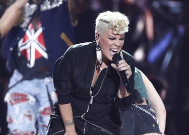 FILE - In this Sept. 22, 2017, file photo, Pink performs at the 2017 iHeartRadio Music Festival Day 1 held at T-Mobile Arena in Las Vegas. NFL announced Monday, Jan. 8, 2018, that the pop star will perform The Star-Spangled Banner before the Big Game on Feb. 4 at U.S. Bank Stadium in Minneapolis. (Photo by John Salangsang/Invision/AP, File) ORG XMIT: NYAG108
