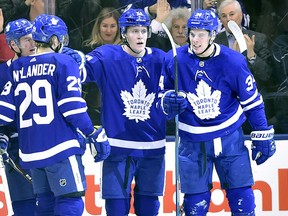Jake Gardiner, centre, celebrates a goal with Maple Leafs teammates during a game against the Florida Panthers on March 28, 2018