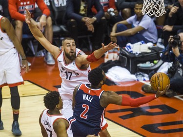 Toronto Raptors Jonas Valanciunas during Eastern Conference Playoff Game 1 first half action against Washington Wizards John Wall at the Air Canada in Toronto, Ont. on Saturday April 14, 2018. Ernest Doroszuk/Toronto Sun/Postmedia Network