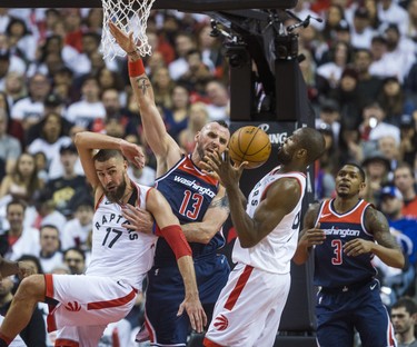 Toronto Raptors Jonas Valanciunas (left) and Serge Ibaka during Eastern Conference Playoff Game 1 first half action against Washington Wizards Marcin Gortat at the Air Canada in Toronto, Ont. on Saturday April 14, 2018. Ernest Doroszuk/Toronto Sun/Postmedia Network