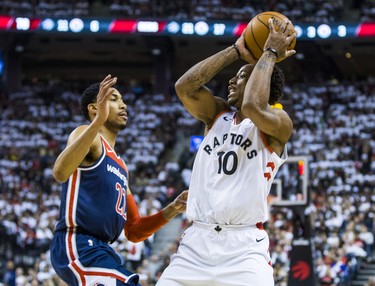 Toronto Raptors DeMar DeRozan during Eastern Conference Playoff Game 1 first half action against Washington Wizards Otto Porter at the Air Canada in Toronto, Ont. on Saturday April 14, 2018. Ernest Doroszuk/Toronto Sun/Postmedia Network