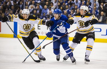 Toronto Maple Leafs Mitch Marner during first period Round 1 Game 3 action against Boston Bruins Brad Marchand
(left) and Charlie McAvoy at the Air Canada Centre in Toronto, Ont. on Monday April 16, 2018. Ernest Doroszuk/Toronto Sun/Postmedia Network