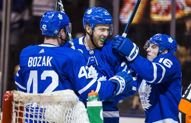 Toronto Maple Leafs James van Riemsdyk (centre and Tyler Bozak (left) and Mitch Marner celebrate a first period Round 1 Game 3 goal against the Boston Bruins at the Air Canada Centre in Toronto, Ont. on Monday April 16, 2018. Ernest Doroszuk/Toronto Sun/Postmedia Network
