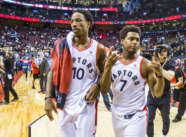Toronto Raptors DeMar DeRozan (left) and Kyle Lowry leave the court following a win against the Washington Wizards in Game 2 of the Eastern Conference - First Round at the Air Canada Centre in Toronto, Ont. on Tuesday April 17, 2018. Ernest Doroszuk/Toronto Sun/Postmedia Network