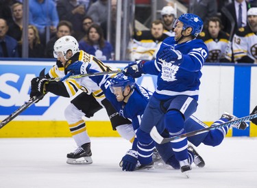 Toronto Maple Leafs Dominic Moore (front) and Andreas Johnsson during first period Round 1 Game 4 playoff action against the Boston Bruins Matt Grzelcyk at the Air Canada Centre in Toronto, Ont. on Thursday April 19, 2018. Ernest Doroszuk/Toronto Sun/Postmedia Network