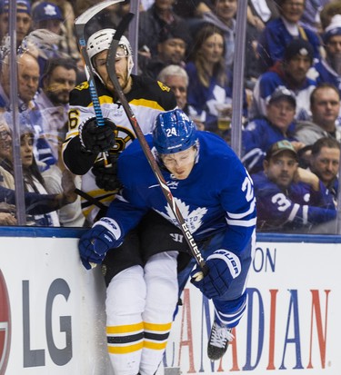 Toronto Maple Leafs Kasperi Kapanen during first period Round 1 Game 4 playoff action against the Boston Bruins Kevan Miller at the Air Canada Centre in Toronto, Ont. on Thursday April 19, 2018. Ernest Doroszuk/Toronto Sun/Postmedia Network