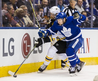 Toronto Maple Leafs Travis Dermott during second period Round 1 Game 4 playoff action against the Boston Bruins Sean Kuraly at the Air Canada Centre in Toronto, Ont. on Thursday April 19, 2018. Ernest Doroszuk/Toronto Sun/Postmedia Network