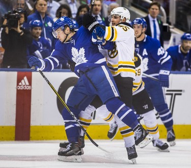 Toronto Maple Leafs Travis Dermott during second period Round 1 Game 4 playoff action against the Boston Bruins Noel Acciari at the Air Canada Centre in Toronto, Ont. on Thursday April 19, 2018. Ernest Doroszuk/Toronto Sun/Postmedia Network